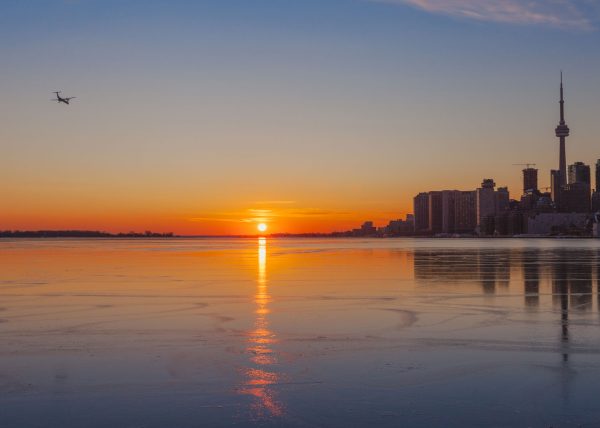Toronto Winter Sunset with Plane Flying by Marcos Lins – Honourable Mention